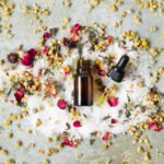 top-view-centered-bottle-with-natural-skin-products